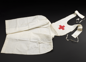 White cotton apron with a red cross, London, England, 1914-1918