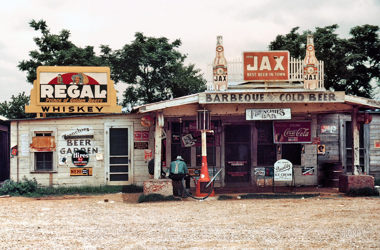 June 1940. Melrose, Louisiana. "A crossroads store, bar, 'juke joint' and gas station in the cotton plantation area." 35mm color transparency by Marion Post Wolcott for the Farm Security Administration.